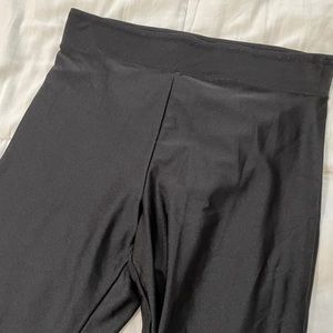 Black high waisted shiny leggings, size medium